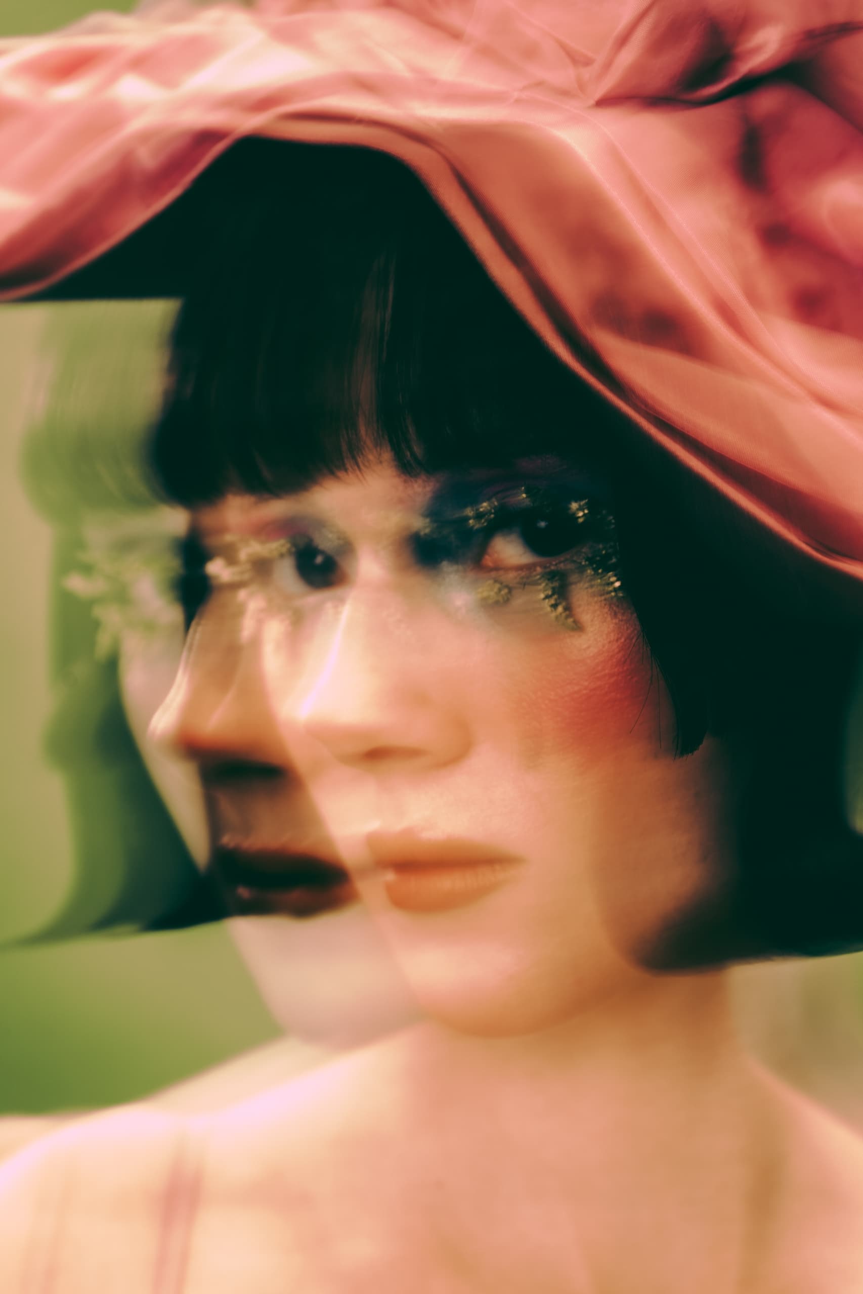 Artistic portrait with soft focus and vibrant colors, creating a dreamlike atmosphere.