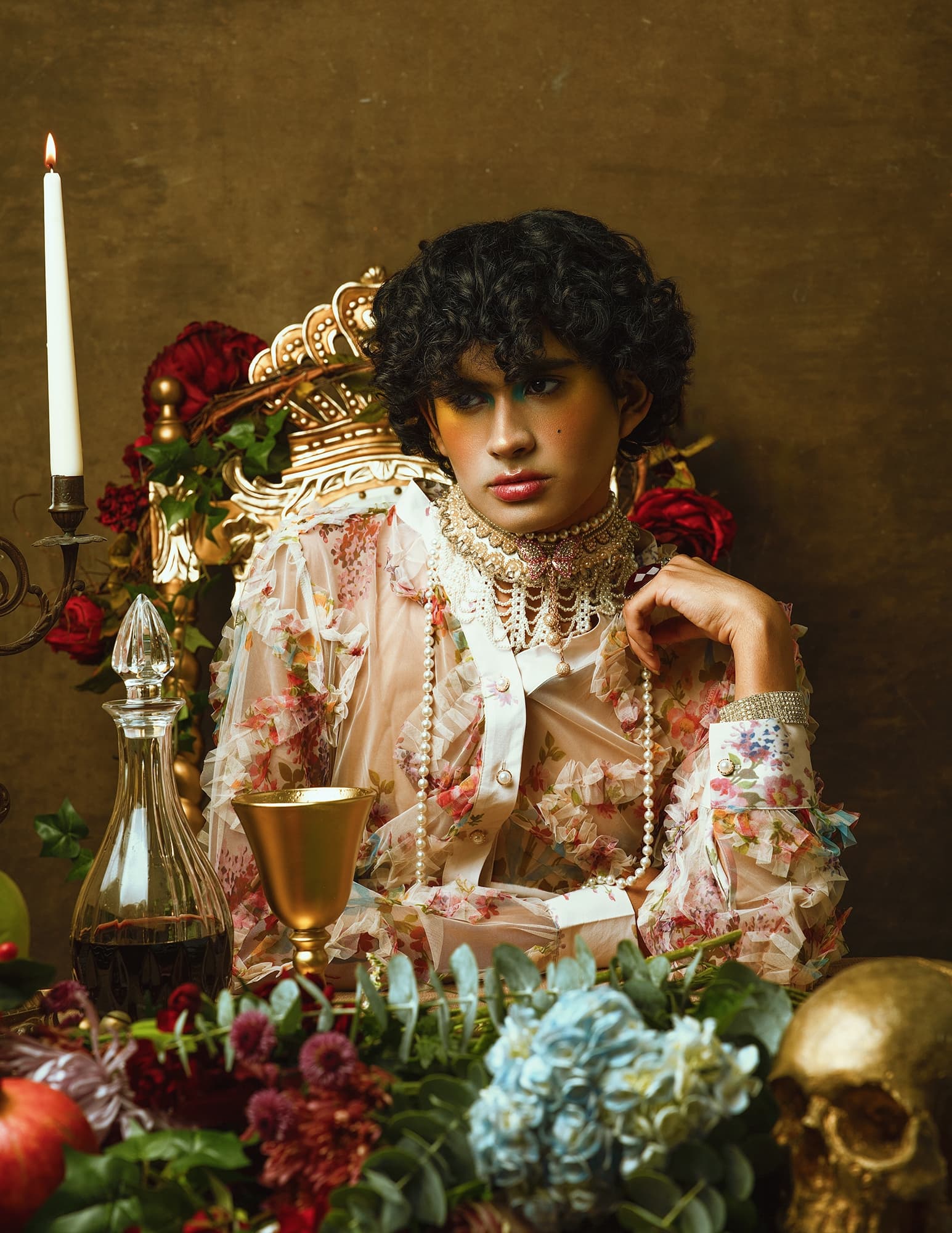 Elegant person in vintage attire with floral decor and golden accessories.