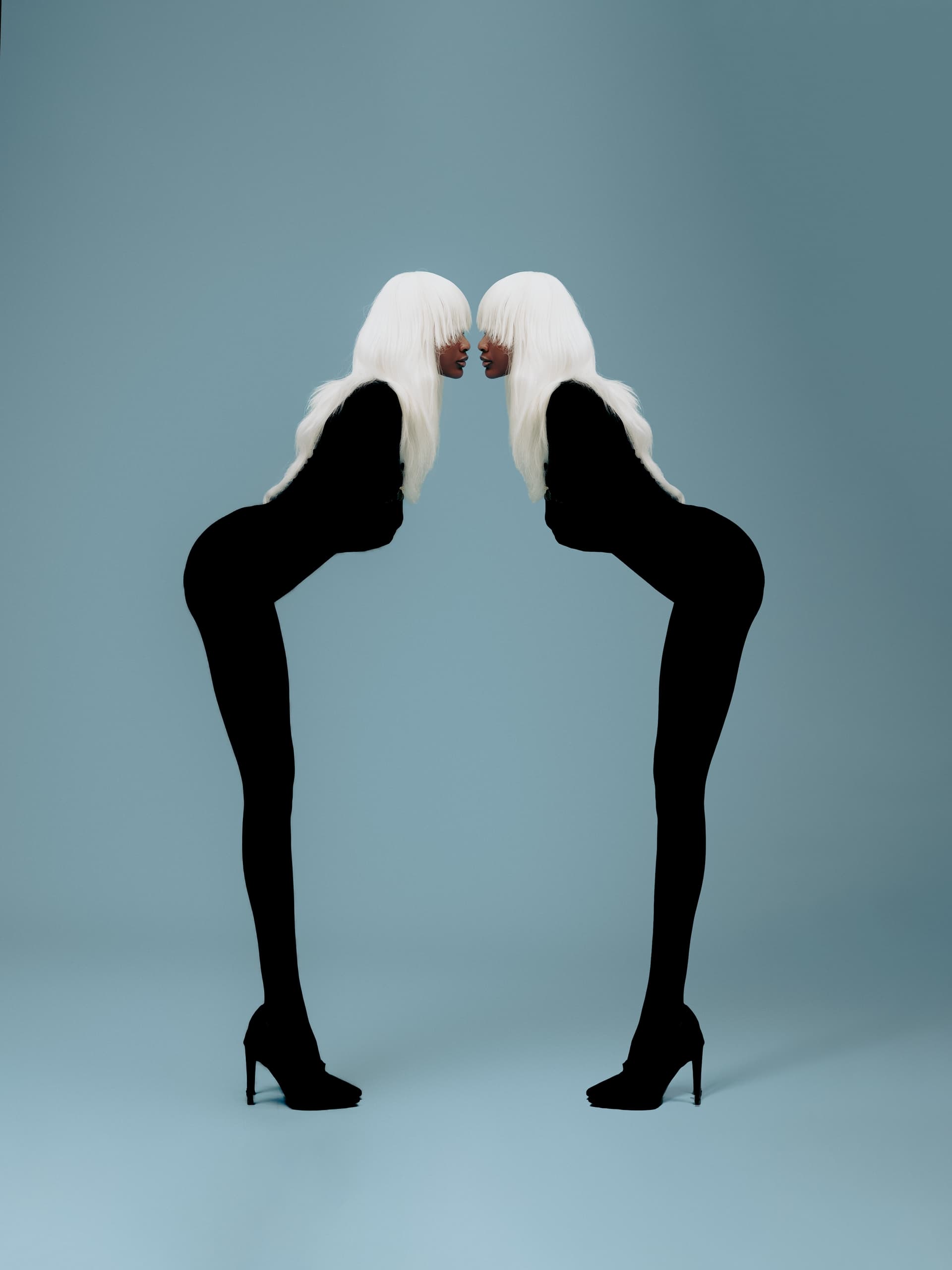 Abstract silhouette art: mirrored figures in black with white hair on a blue background.