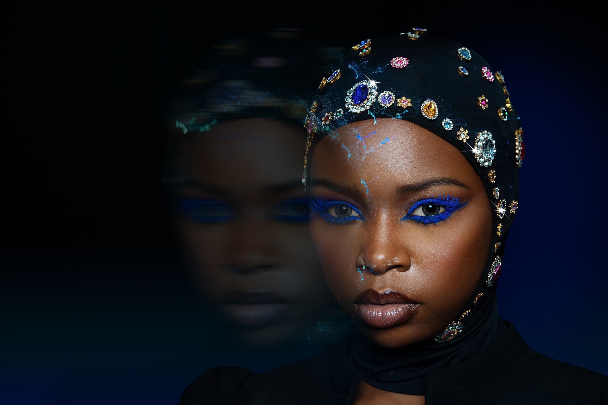Woman in jeweled headscarf and blue makeup, artistic reflection effect.