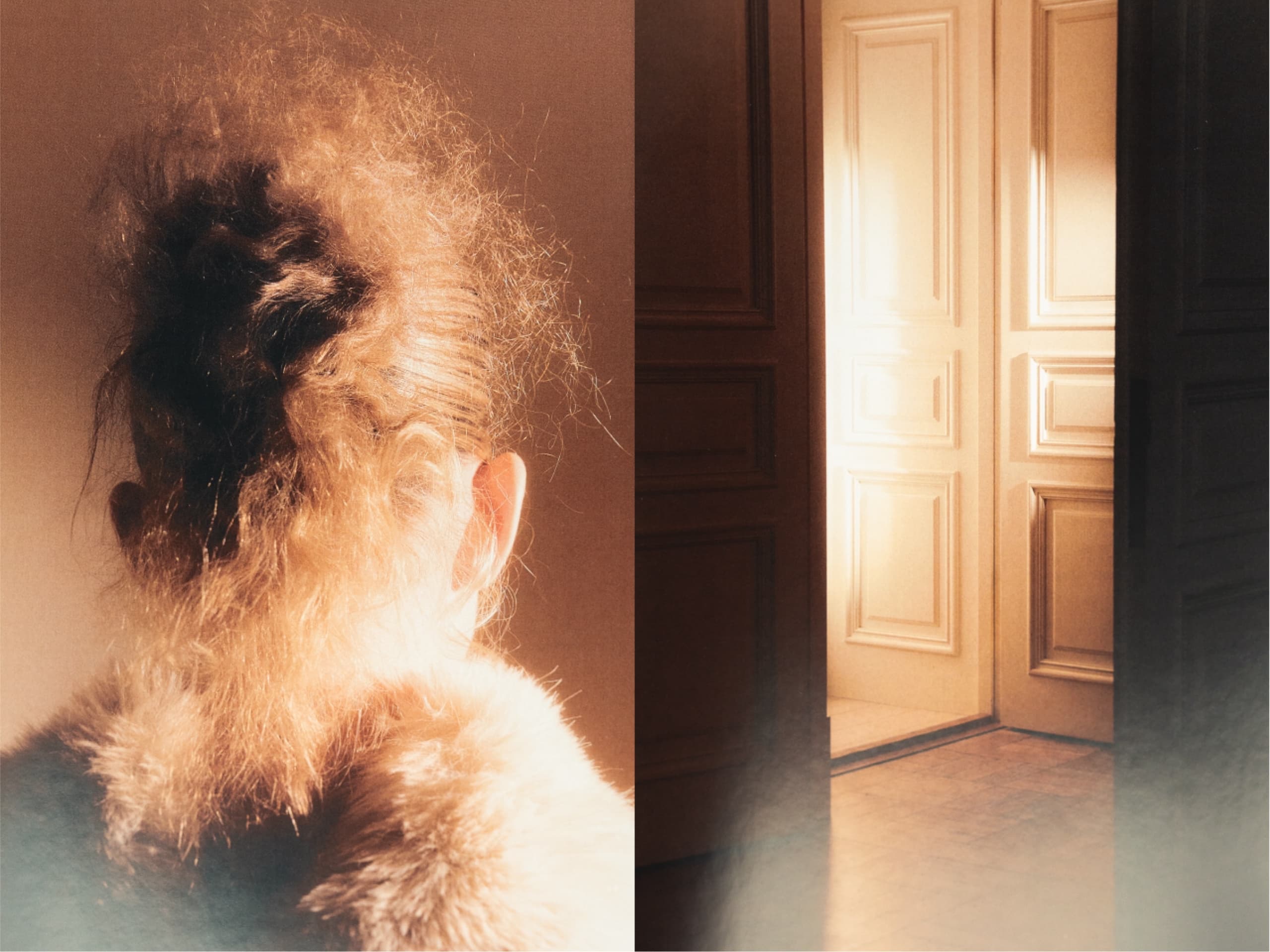 Person with curly hair beside an elegant, sunlit open door.