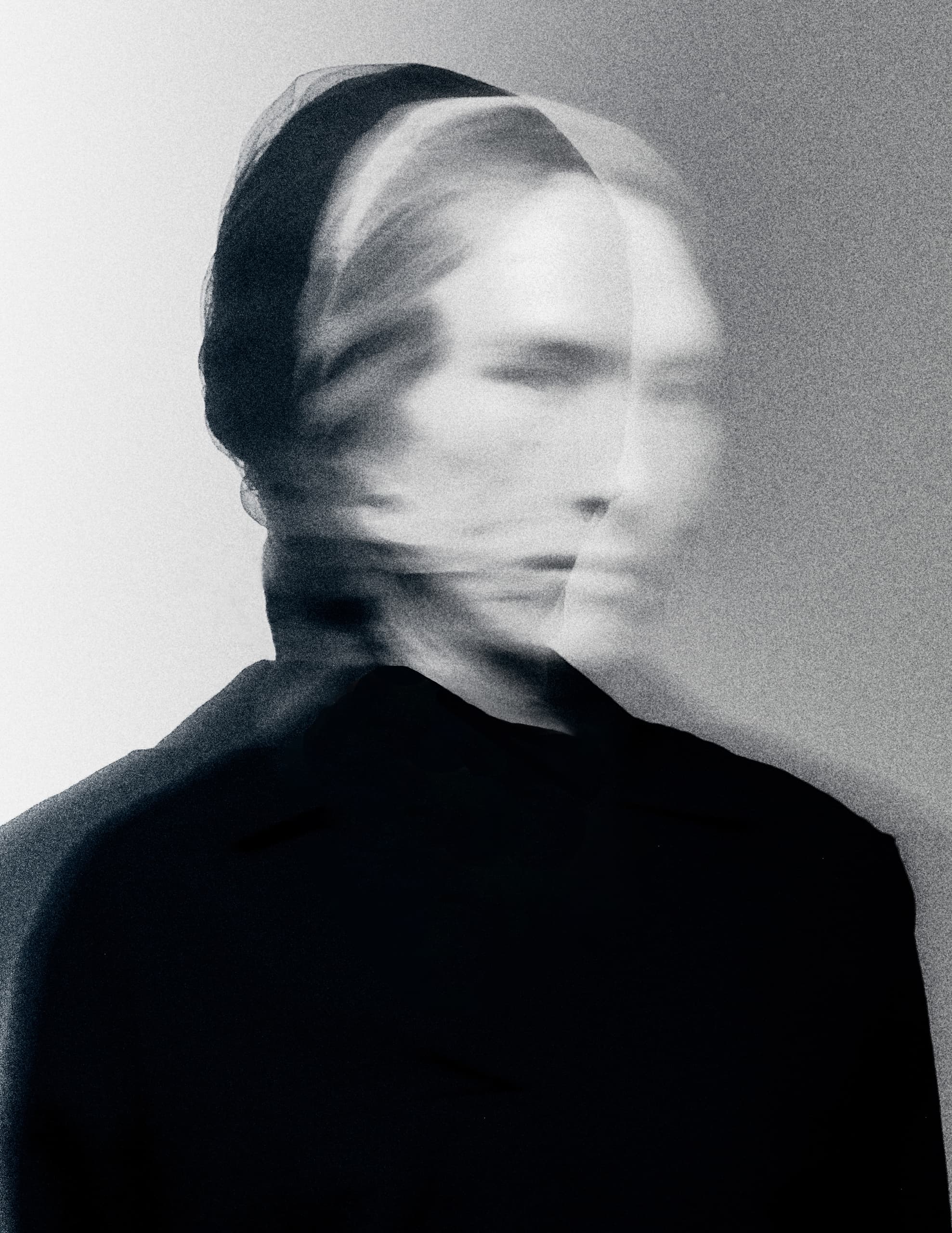 Abstract blurred portrait of a person, monochrome artistic photography.