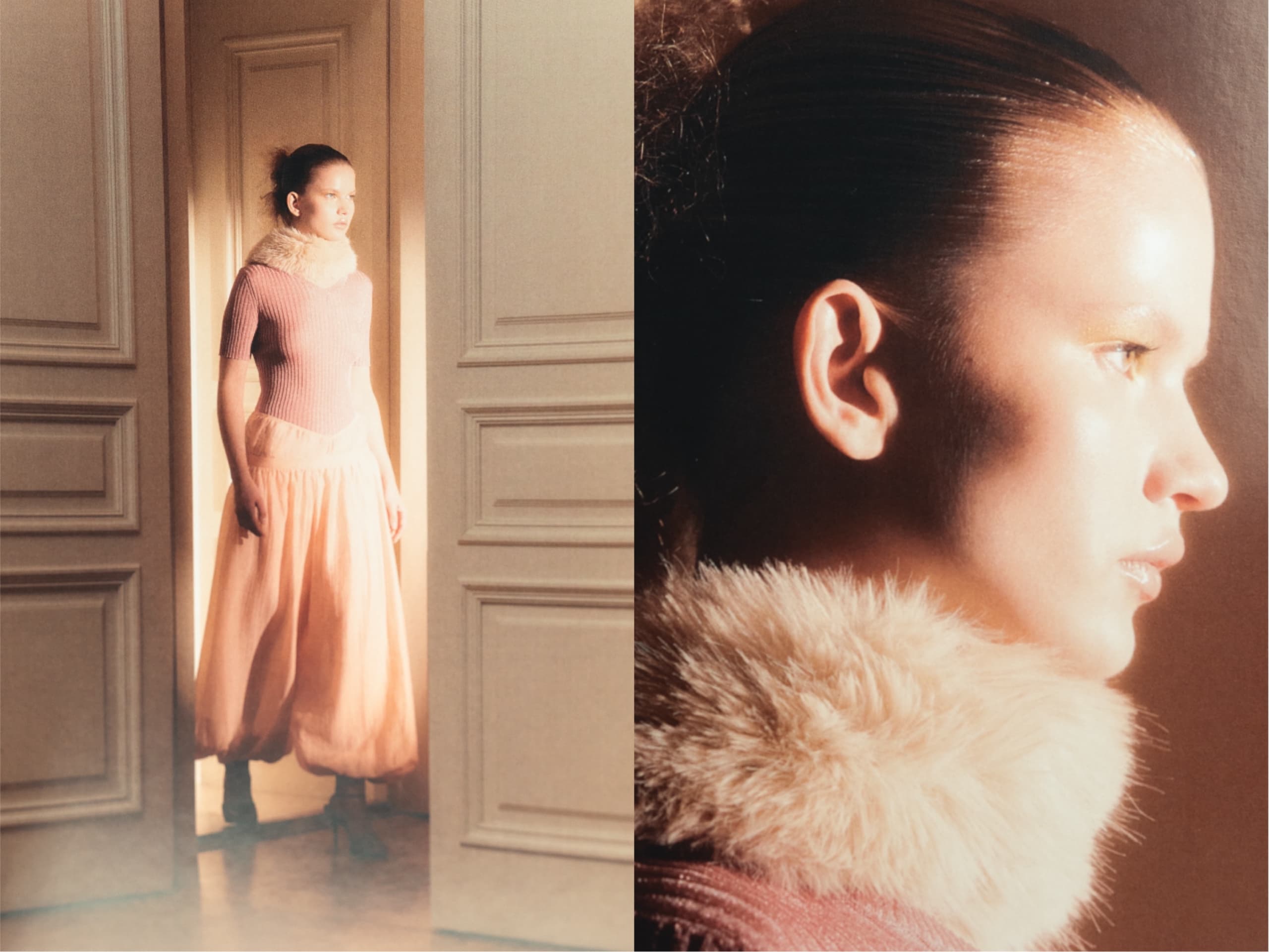 Woman in soft pink outfit and fur collar, illuminated by warm light through a doorway.