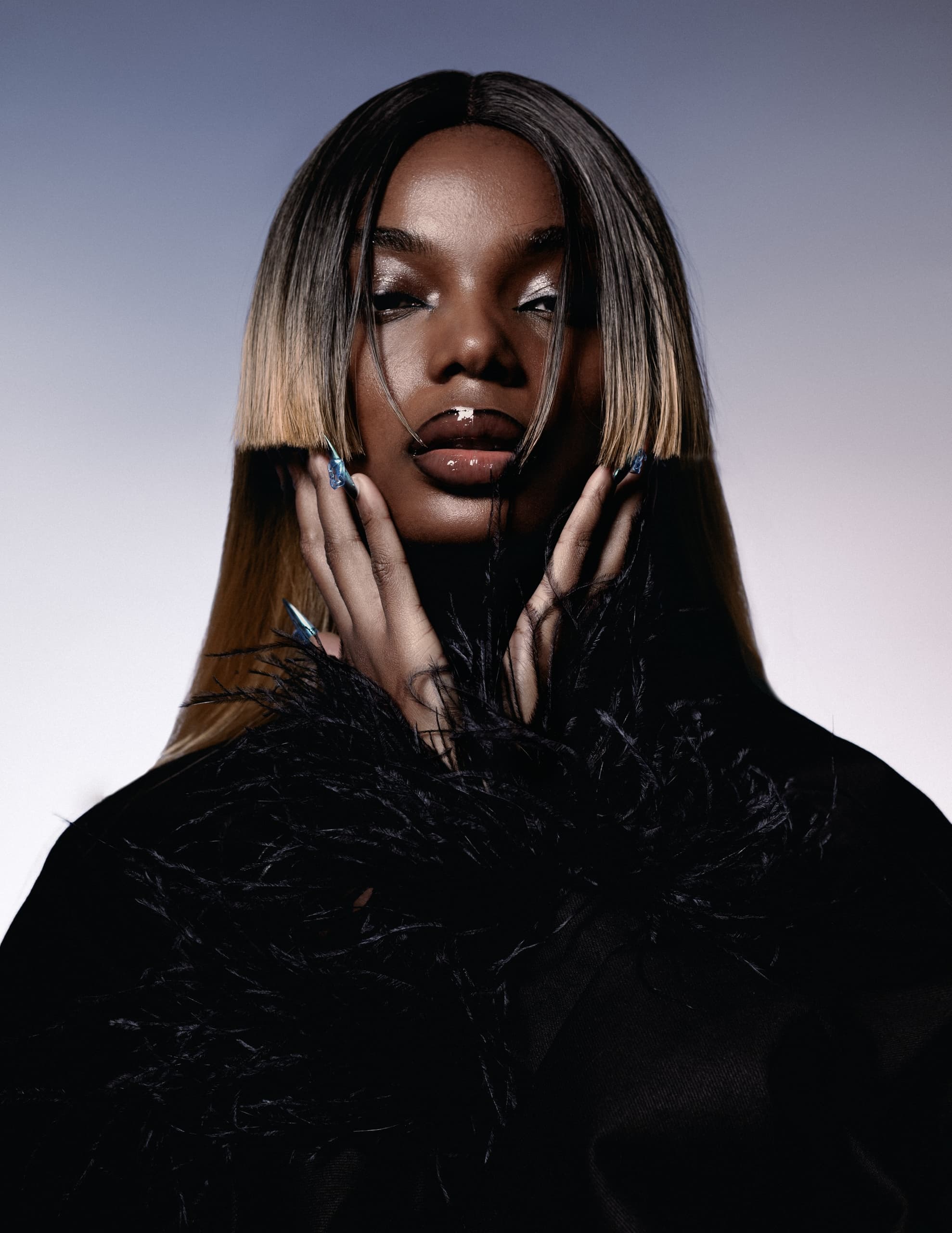 Fashionable woman in black feathered coat, artistic portrait with sleek hairstyle.