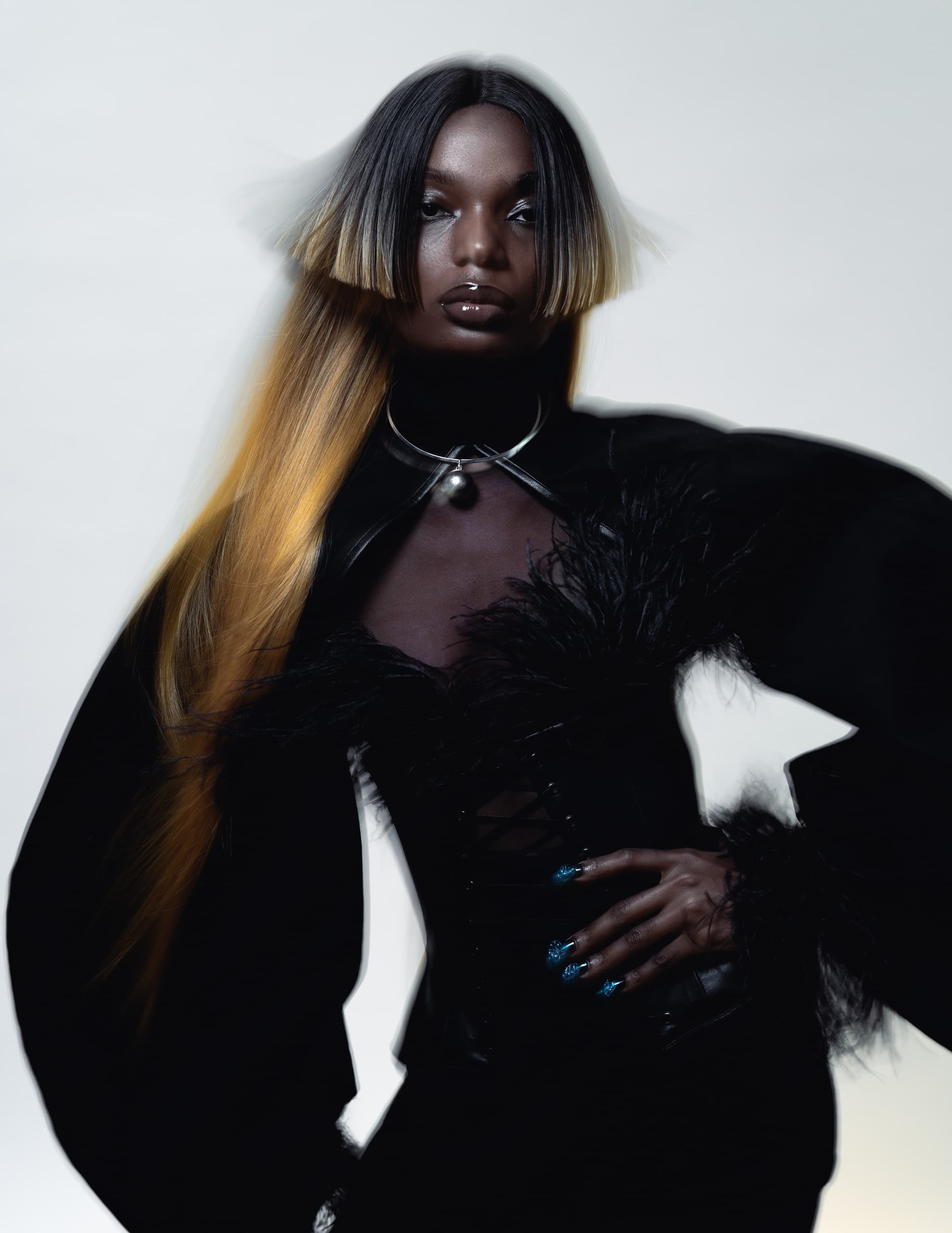 Avant-garde fashion portrait with striking hair and bold, futuristic style.