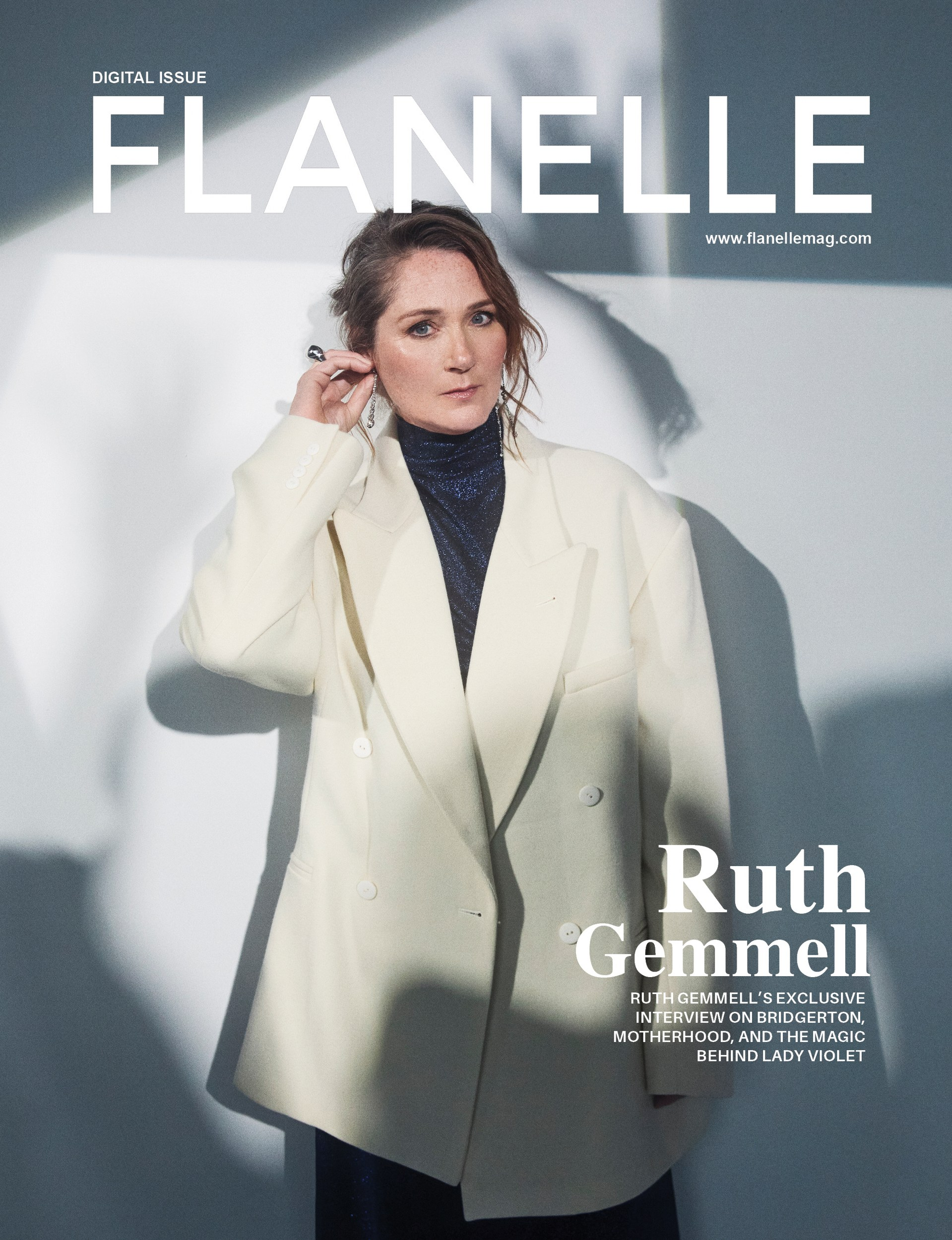 Fashion magazine cover featuring a woman in a cream blazer and dark dress.