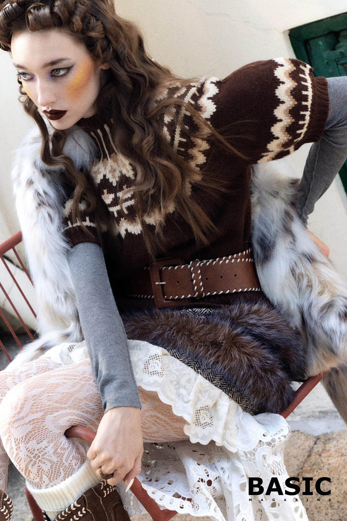 Fashion model in a cozy knit sweater and lace skirt for BASIC Magazine.