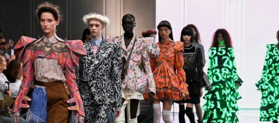 Models showcasing avant-garde fashion designs on the runway.