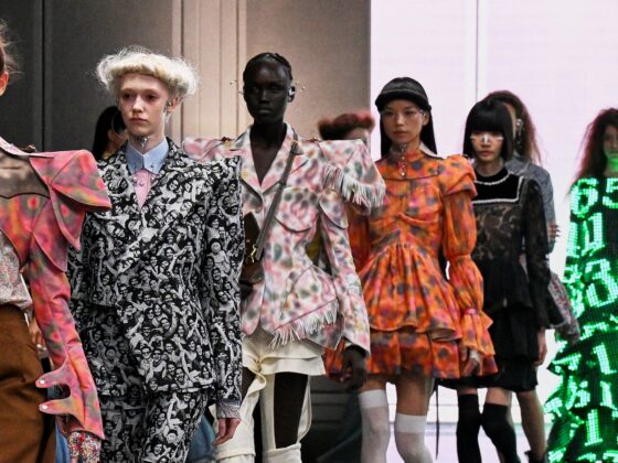 Models showcasing avant-garde fashion designs on the runway.