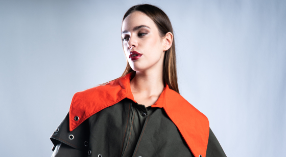Fashionable woman in orange and dark coat, stylish and modern look.
