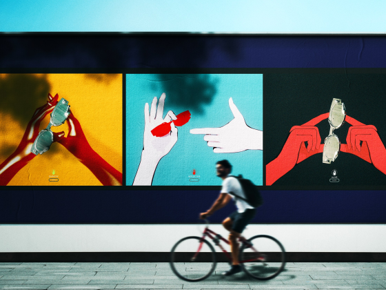 Colorful billboard art depicting hands with glasses, cyclist passing by in the foreground.