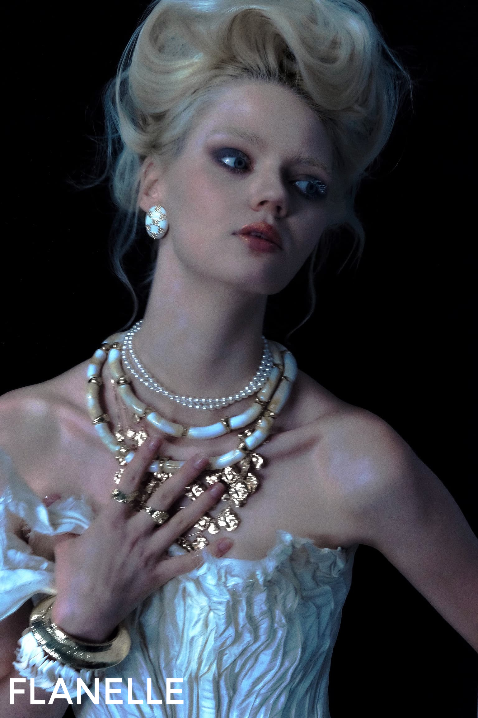 Elegant woman in vintage fashion jewelry and dress, dark background.