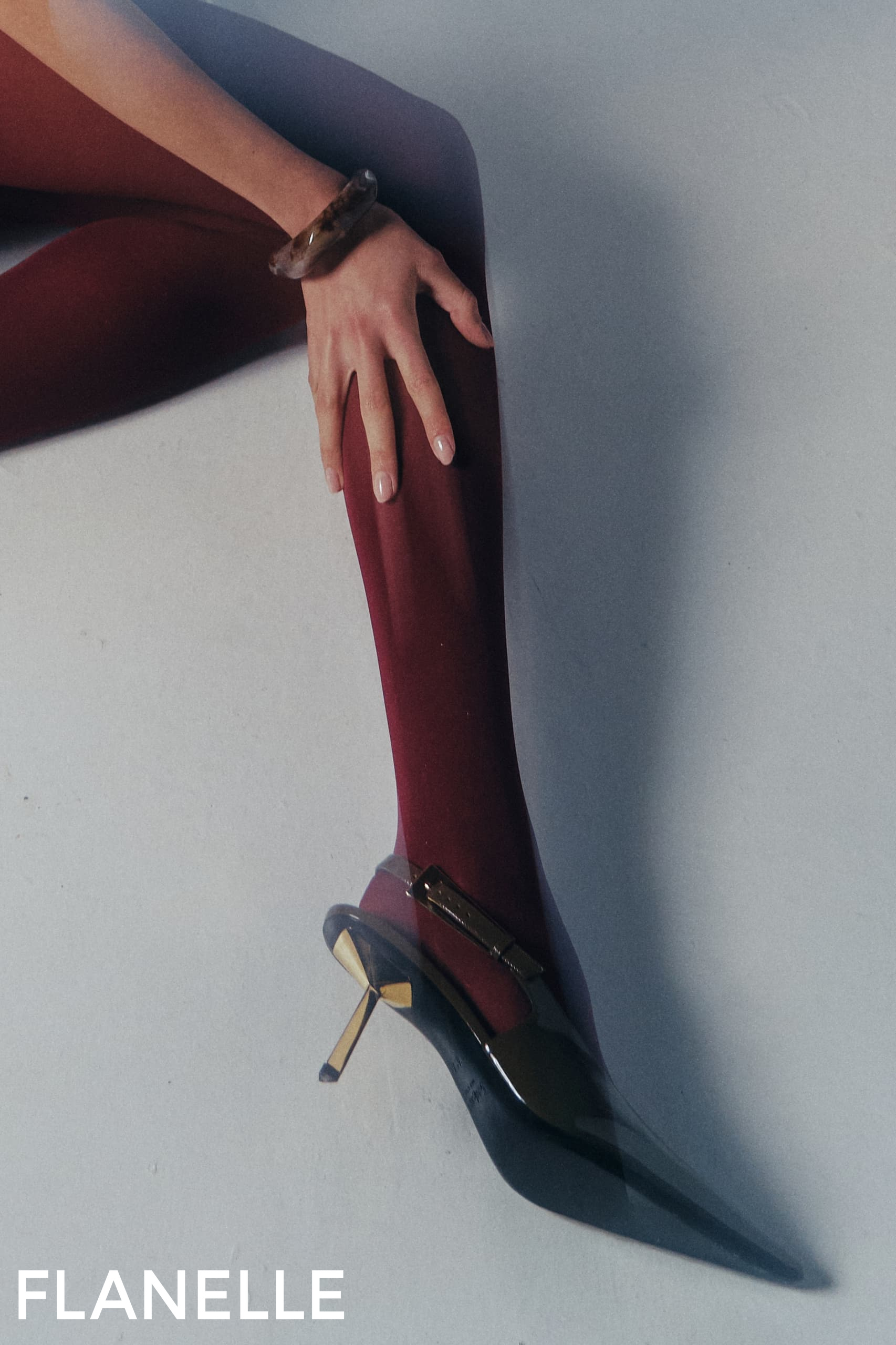 Elegant red stockings and black heels fashion shot.