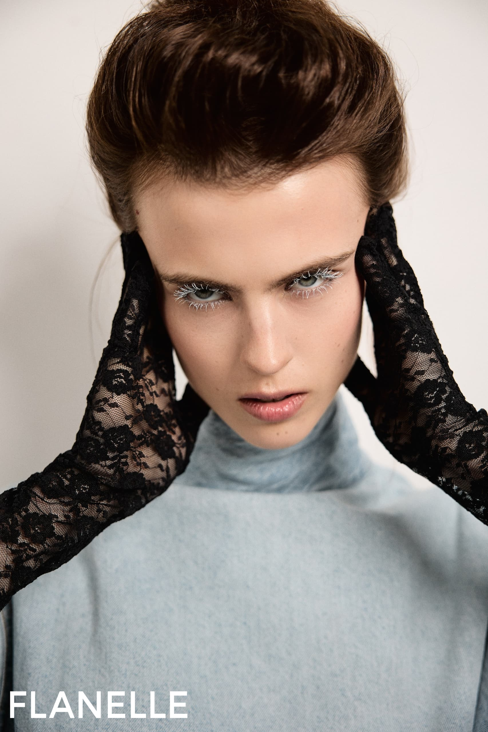 Model with lace gloves and dramatic makeup for Flanelle fashion shoot.