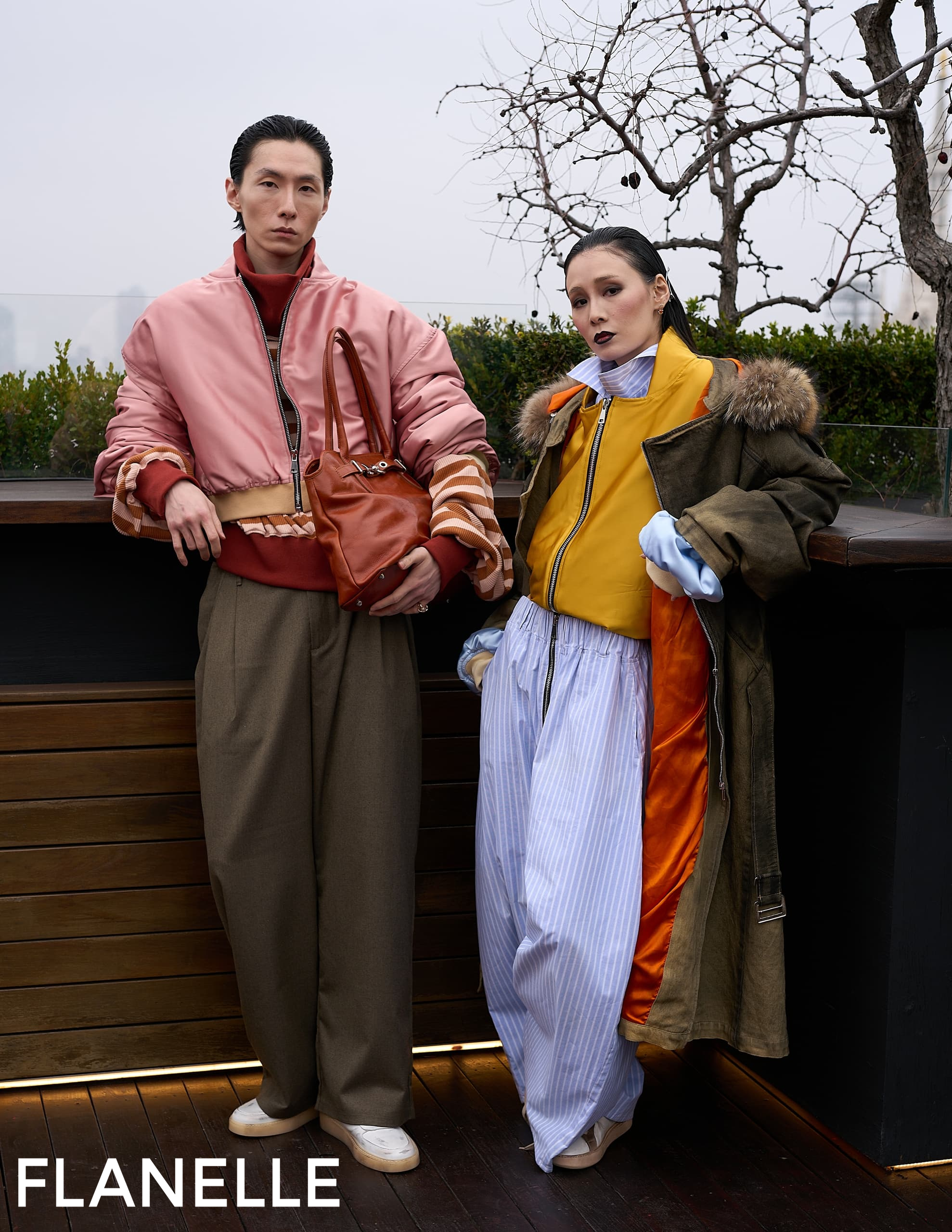 Fashionable duo in stylish winter outfits outdoors. Flanelle magazine photoshoot.