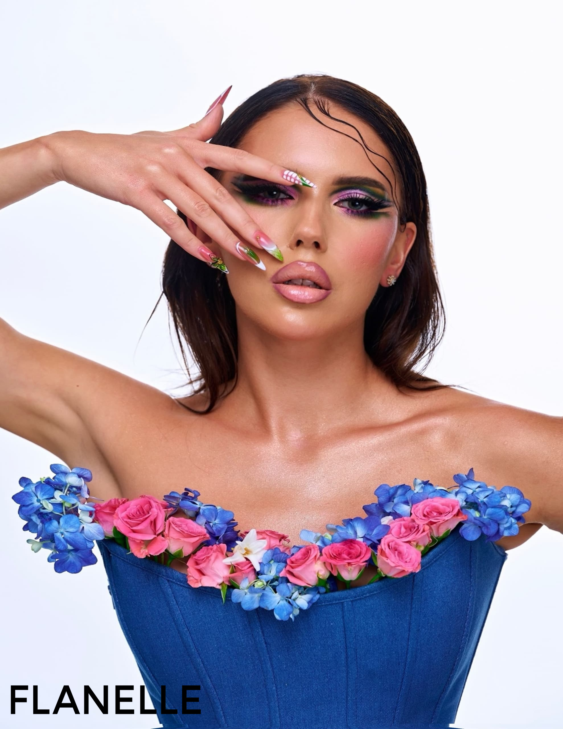 Model with vibrant makeup, floral outfit, bold nails | Flanelle fashion shoot.