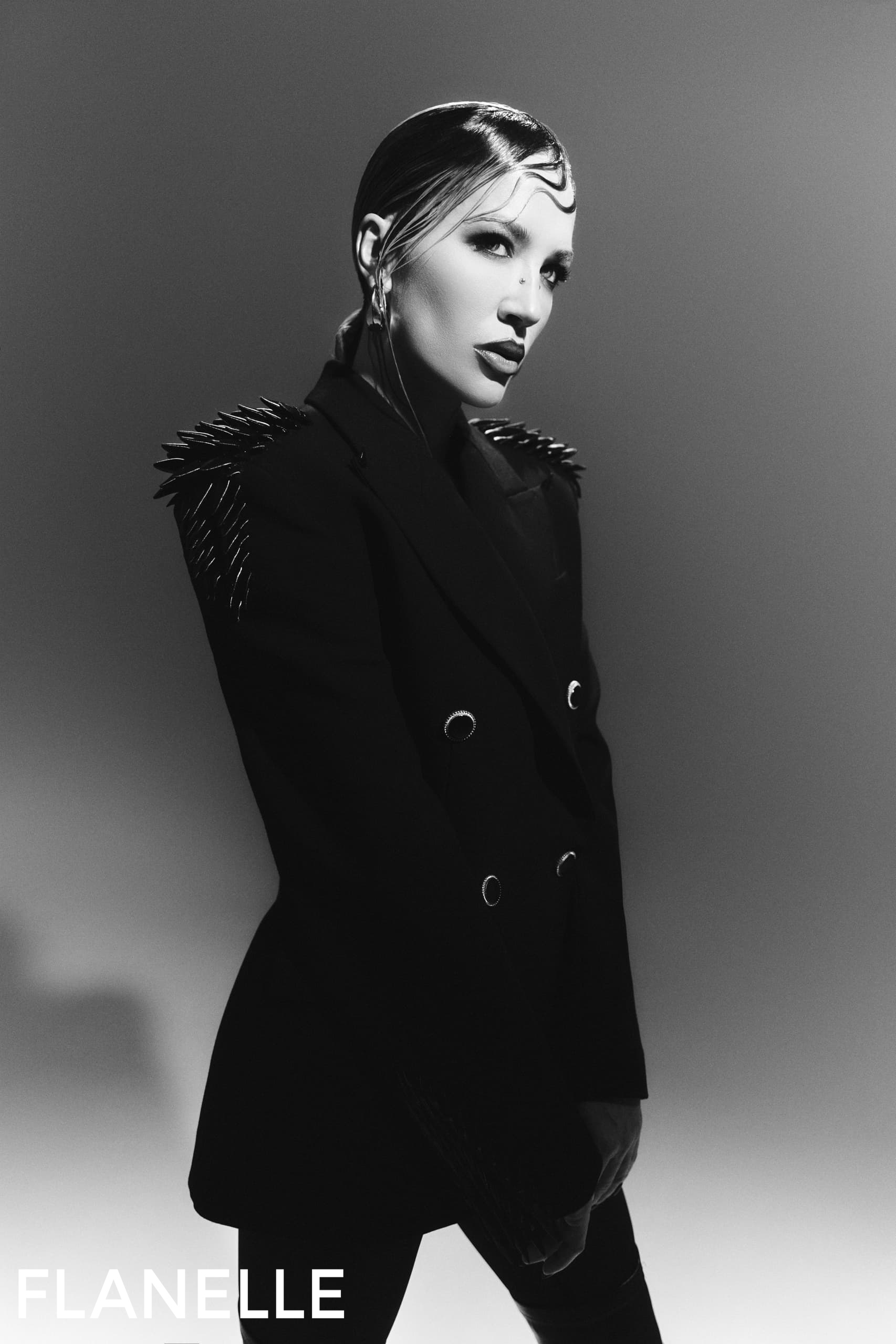 Black and white fashion portrait with a stylish, edgy blazer.
