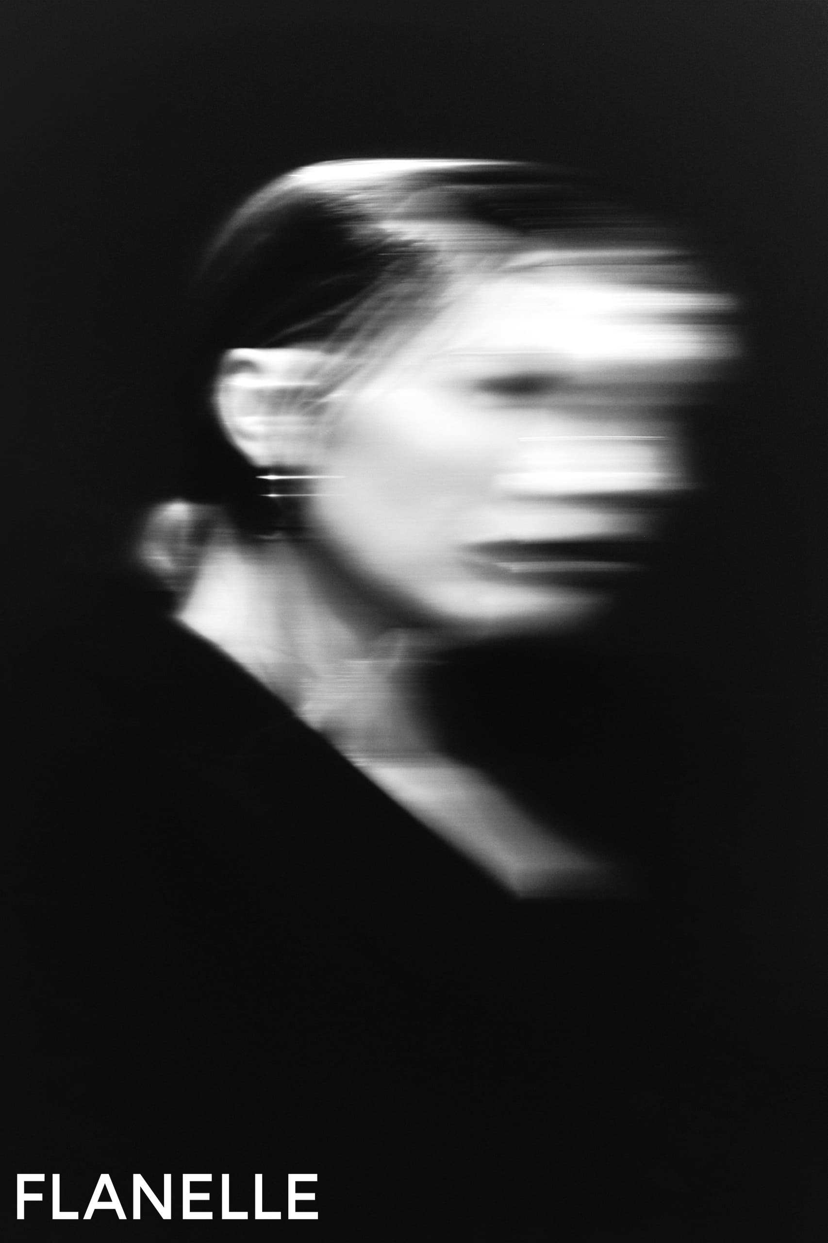 Blurred portrait in motion, black and white abstract art.