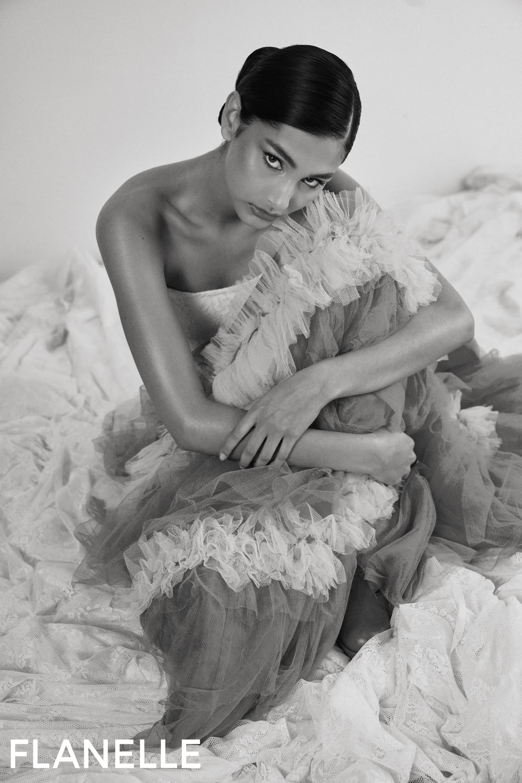 Elegant woman in a tulle dress, black and white fashion portrait, Flanelle magazine.