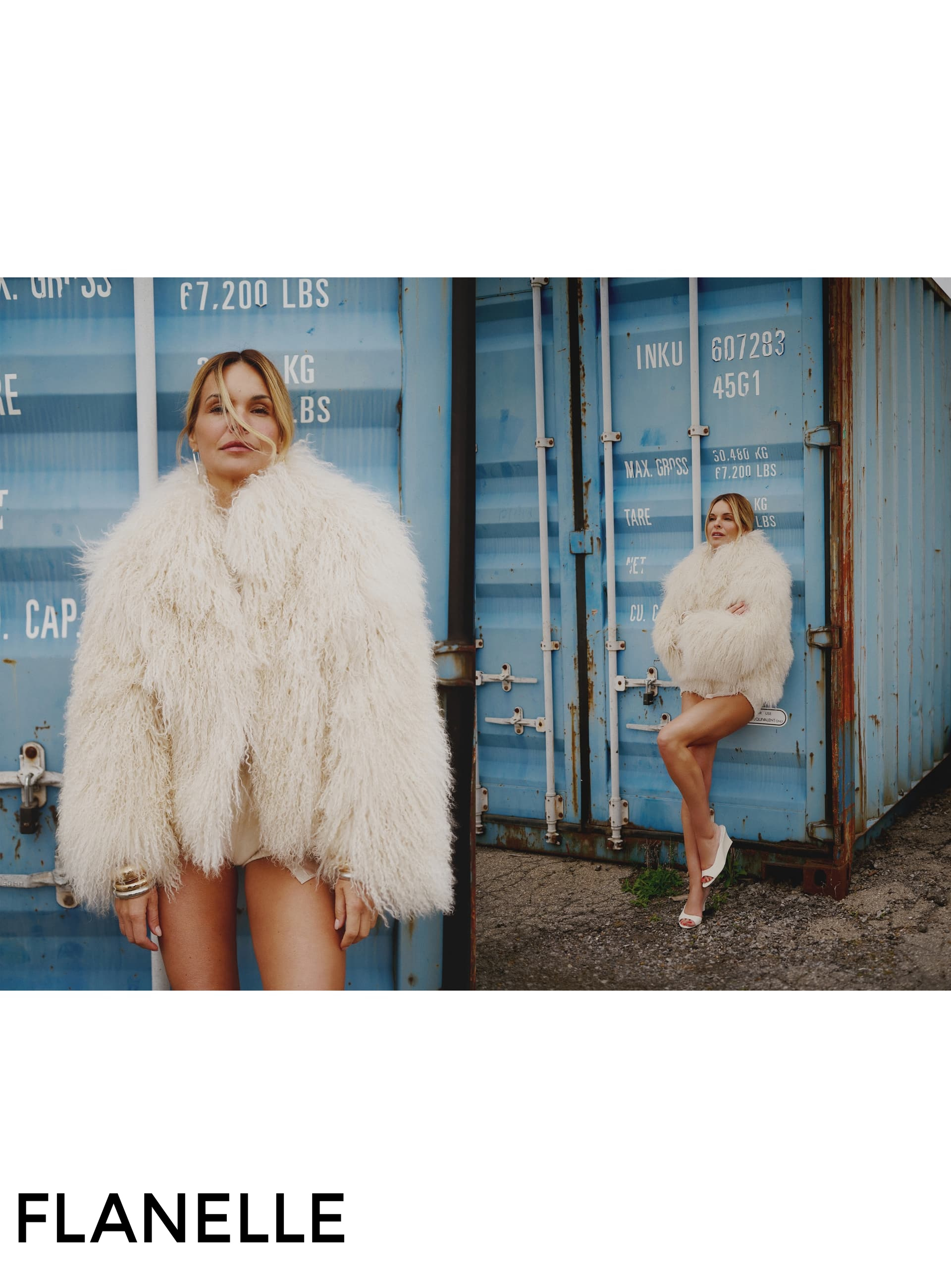 Fashion model in fluffy coat poses by shipping container.