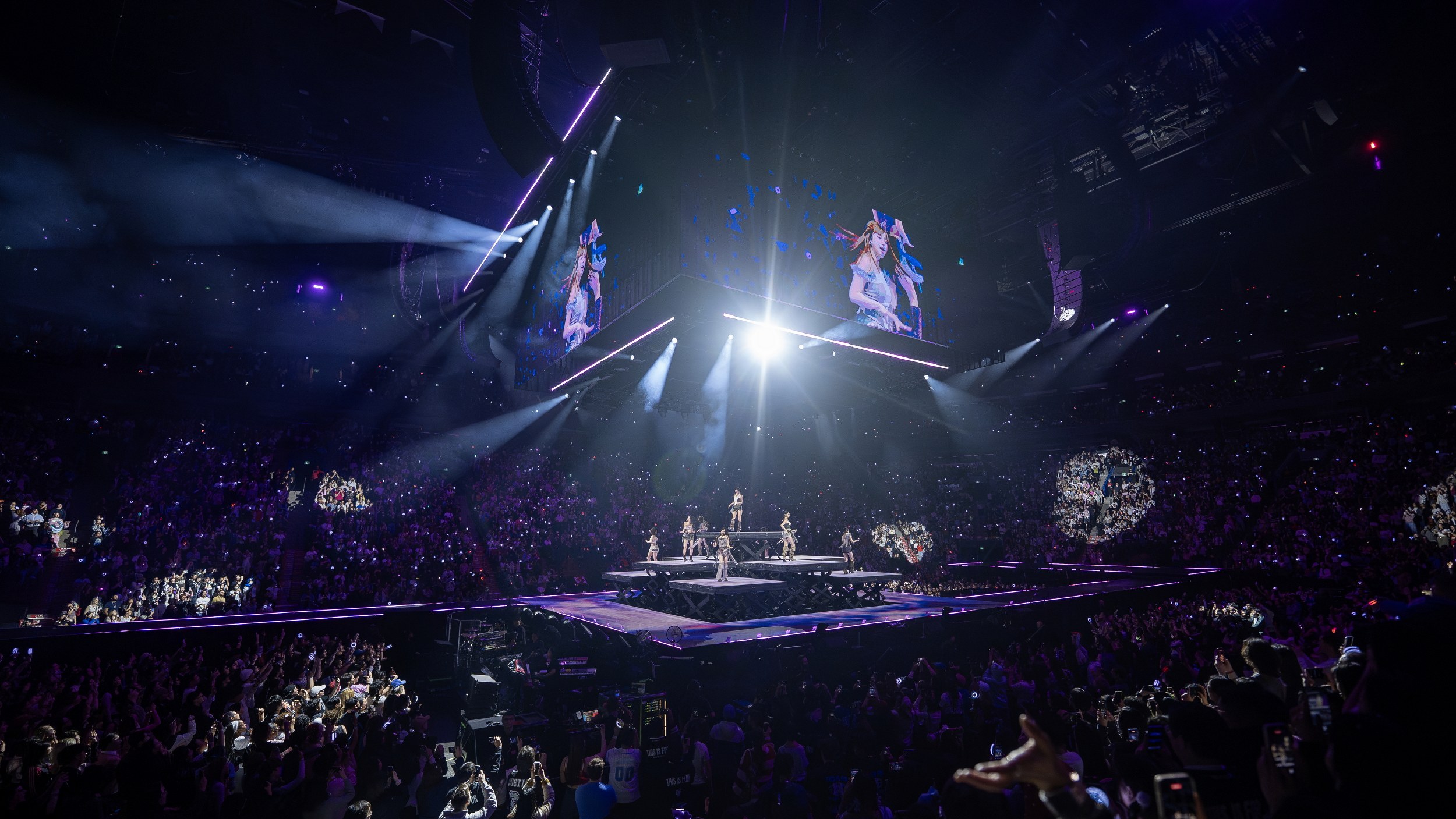 Energetic concert crowd enjoying a spectacular live performance.