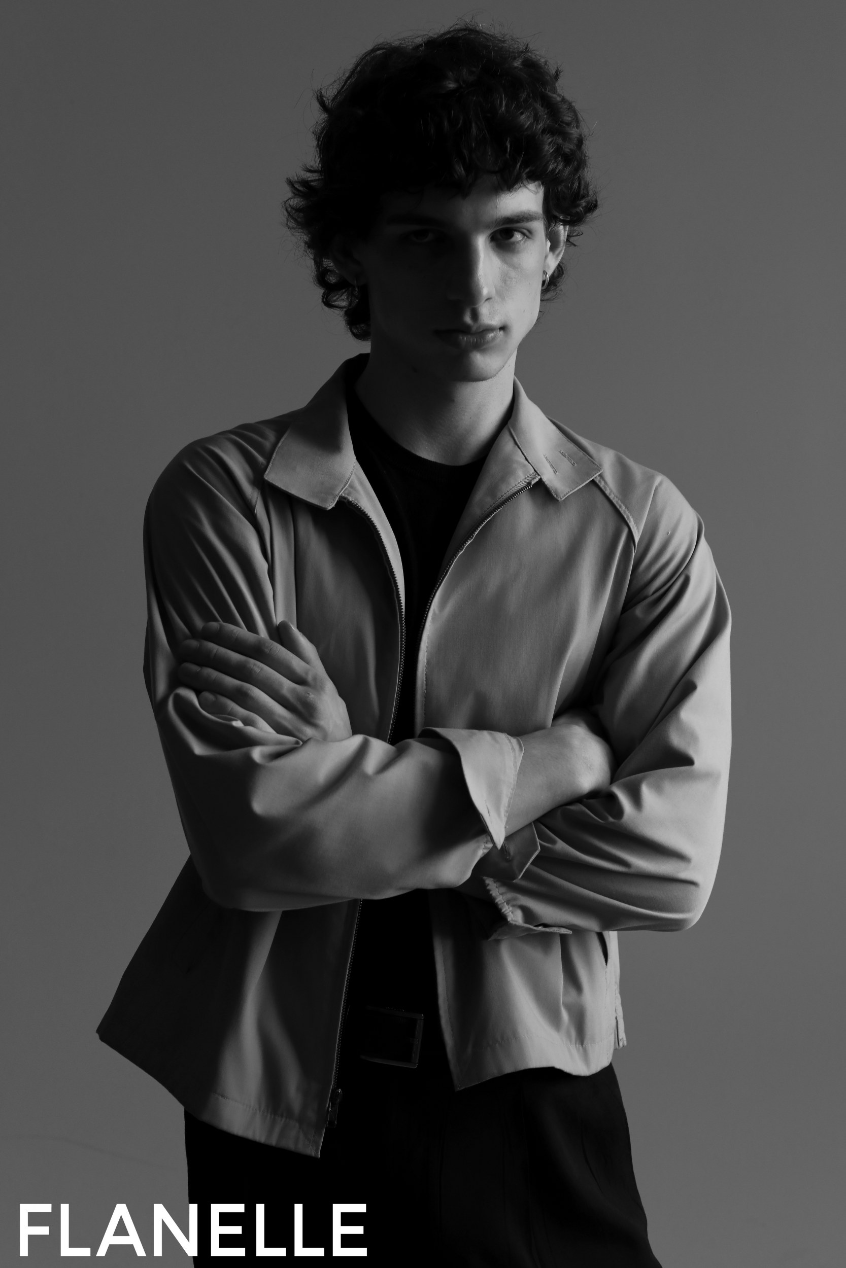 Black and white portrait of a model in a stylish jacket. Flanelle. Fashion photography.