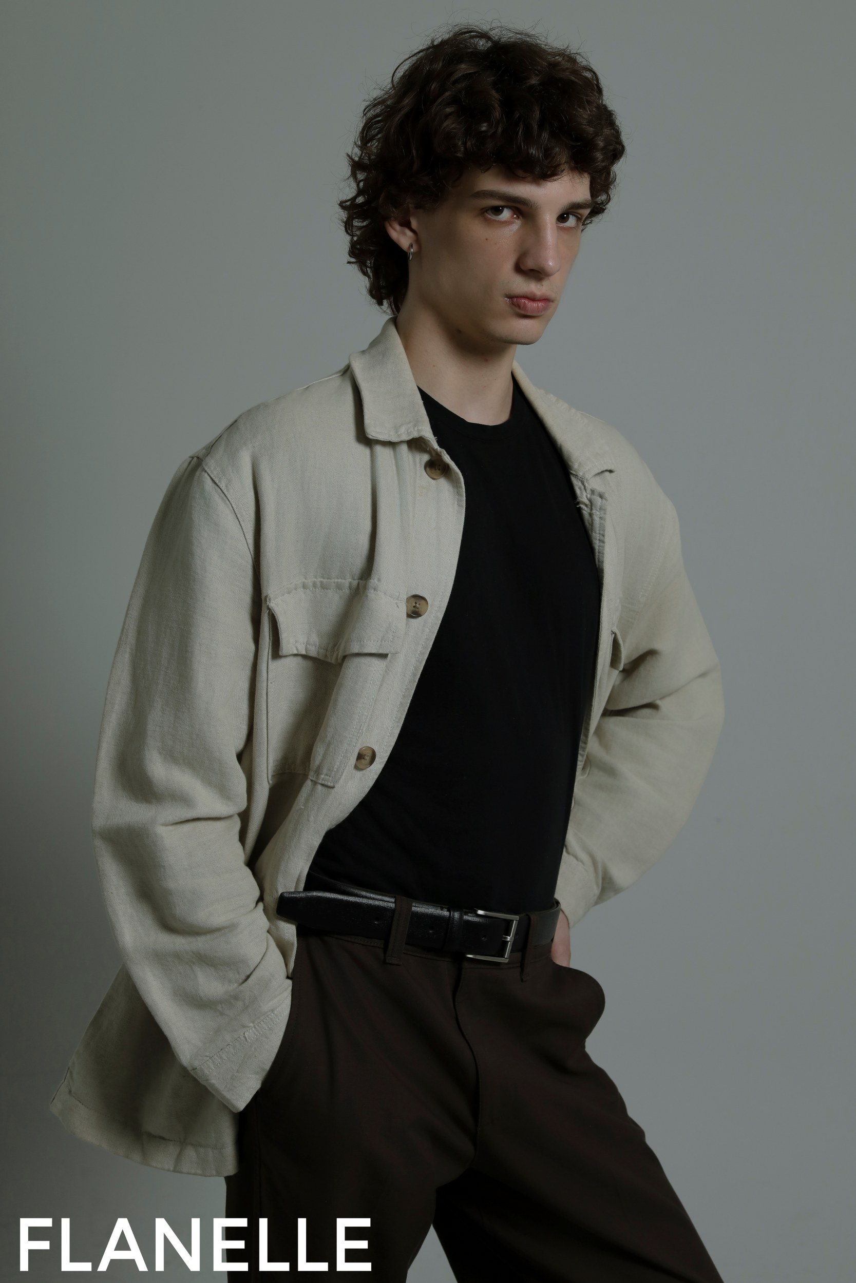 Fashion model in chic neutral outfit from Flanelle photoshoot.